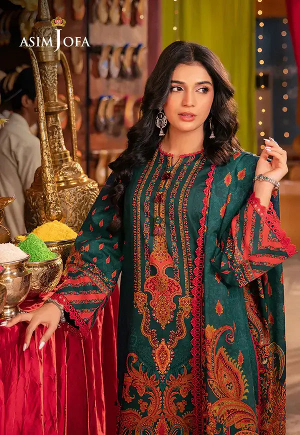 Woman wearing a green and red embroidered dress with a colorful background