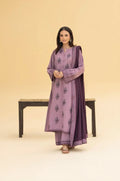 Woman wearing a purple traditional outfit with a matching dupatta on a beige background
